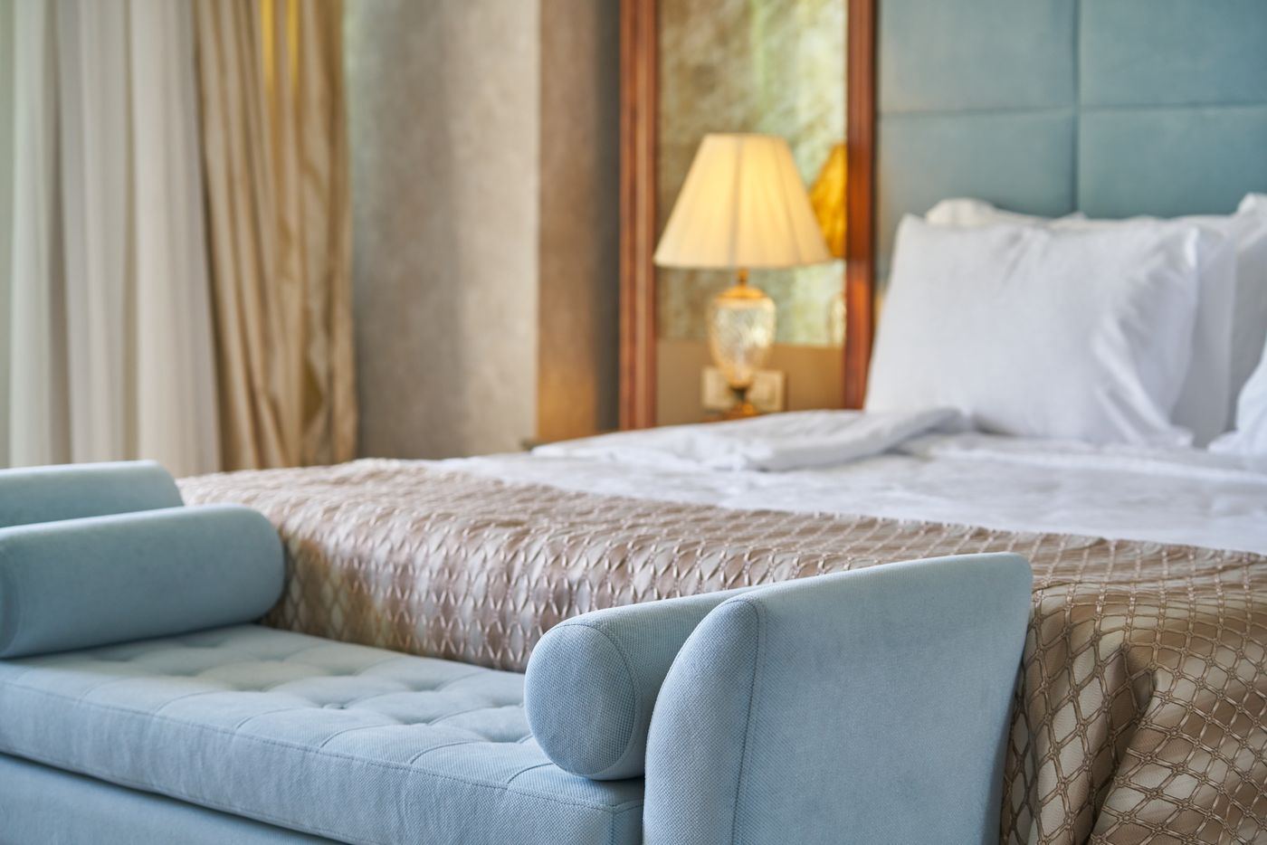Freshly made bed with crisp white linens in a calm bedroom